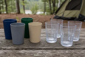 PP vs Tritan camping cups shown in a clearly separated outdoor comparison scene