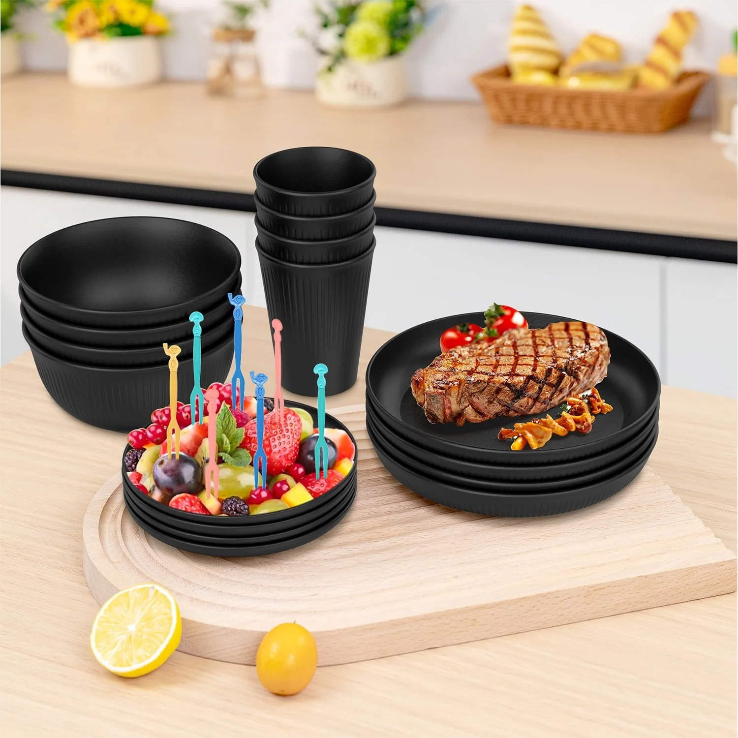 Black dinnerware tabletop detail Matte black round plates bowls and cups arranged on a kitchen table for product surface review